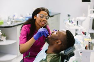 dental assistant practicing to become an orthodontic assistant