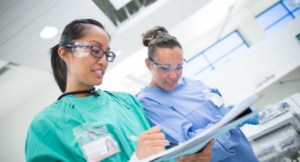 a dental hygienist learning how to perform a procedure