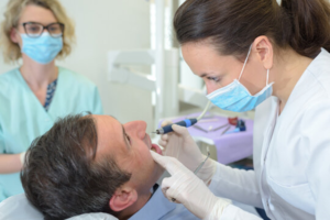 a dental assistant and her instructor 