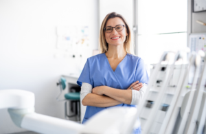 a closeup of a dental assistant smiling 